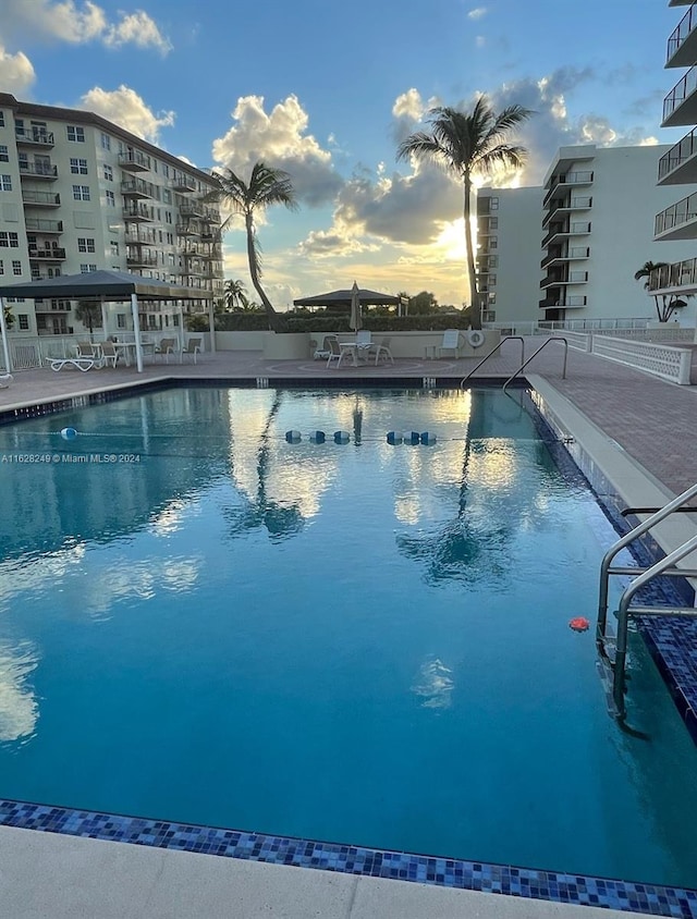 view of pool at dusk