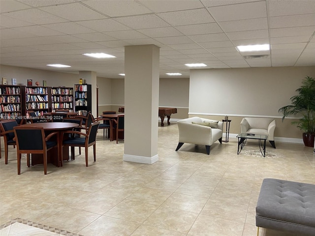 interior space with billiards, a paneled ceiling, and light tile patterned floors