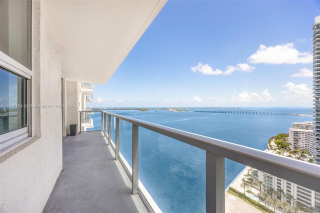 balcony featuring a water view