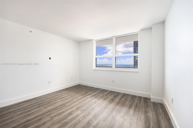 spare room featuring hardwood / wood-style floors