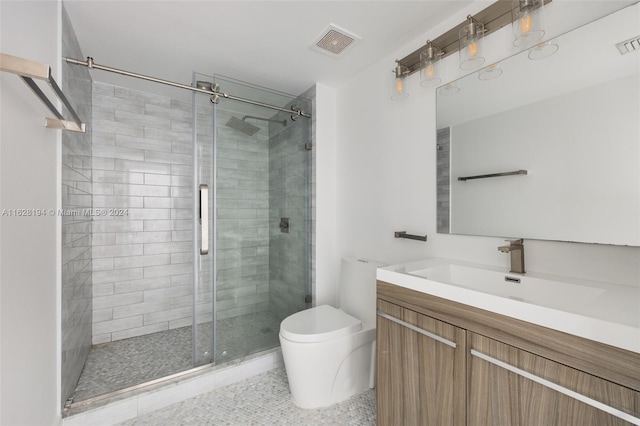 bathroom with tile patterned floors, toilet, vanity, and an enclosed shower