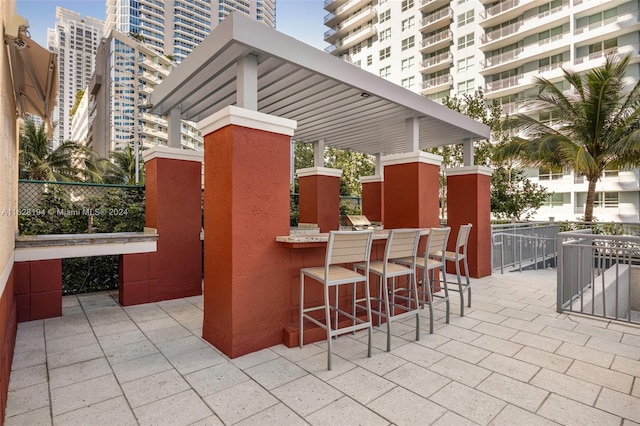 view of patio / terrace featuring an outdoor bar