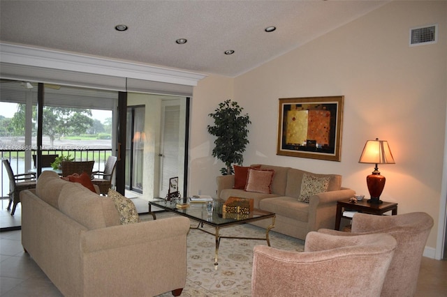 living room with high vaulted ceiling and light tile patterned floors