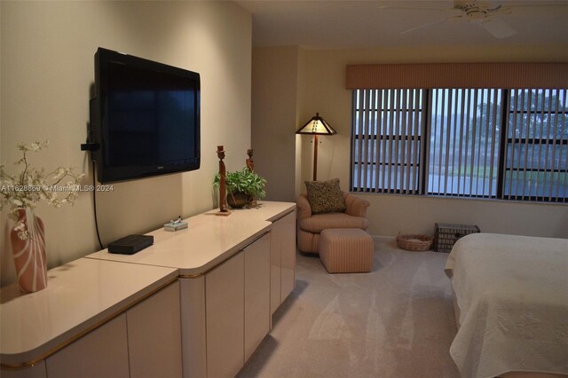 bedroom with light colored carpet and ceiling fan