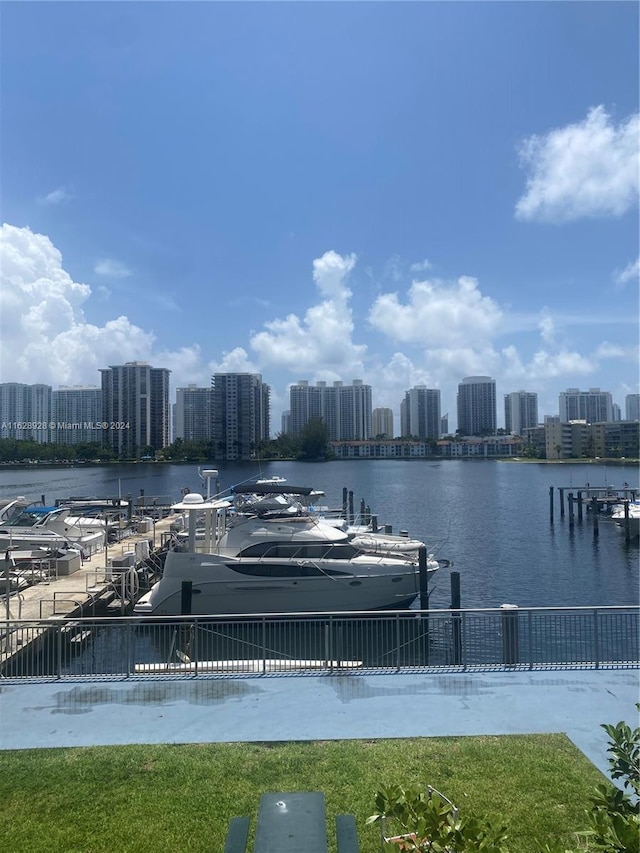 view of home's community with a water view and a boat dock