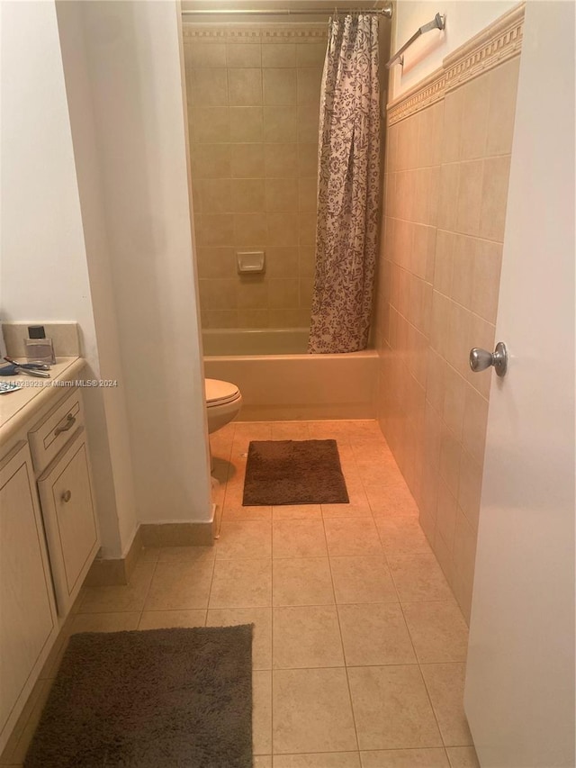 full bathroom featuring vanity, toilet, tile patterned floors, and shower / bath combo