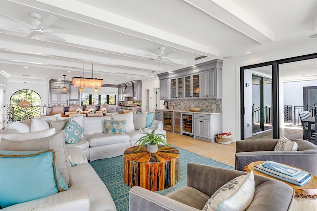 tiled living room with bar, ceiling fan, beverage cooler, and beamed ceiling