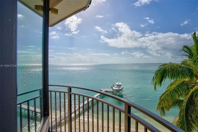 balcony featuring a water view