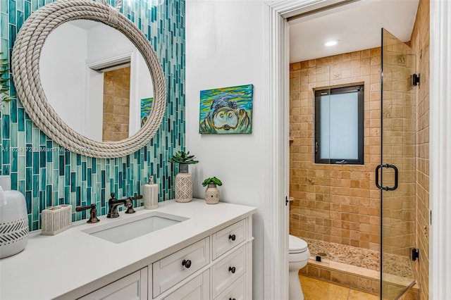 bathroom with tasteful backsplash, walk in shower, vanity, and toilet