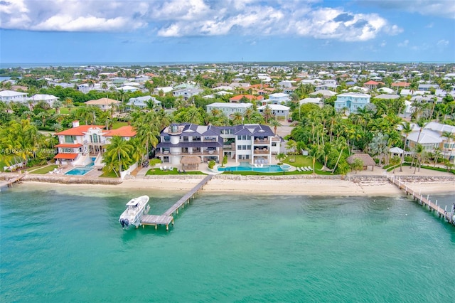 aerial view featuring a water view and a beach view