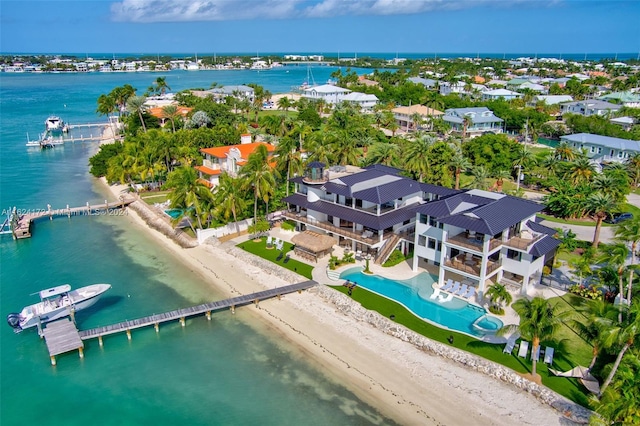 aerial view with a water view and a view of the beach