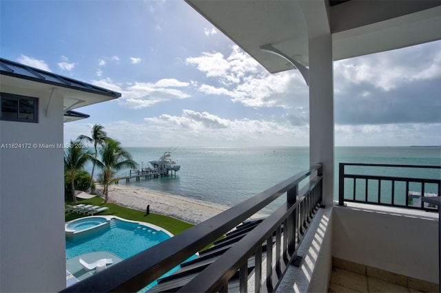 balcony featuring a water view