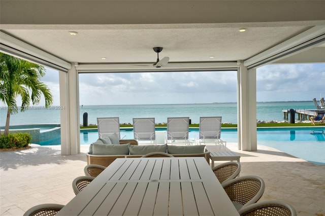 view of patio with a water view and an outdoor hangout area