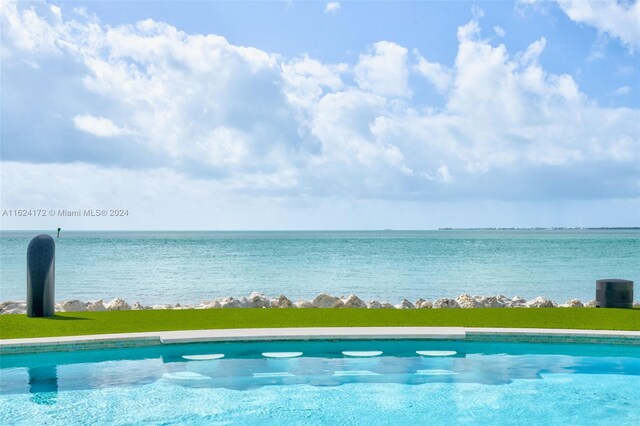 view of pool featuring a water view