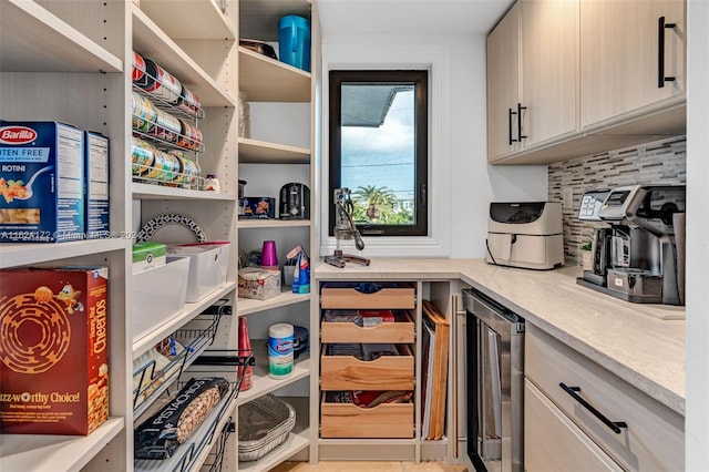 pantry featuring wine cooler