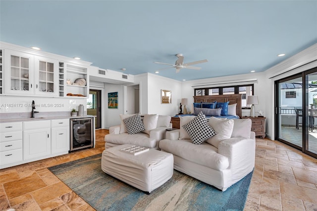 bedroom featuring sink, wine cooler, access to outside, ceiling fan, and crown molding