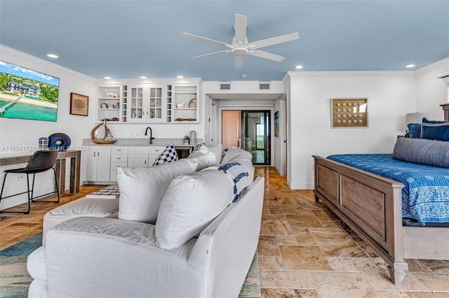 bedroom with crown molding and wet bar