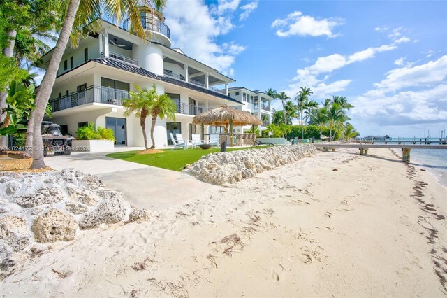 view of property's community featuring a water view and a gazebo