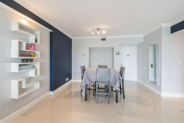 tiled dining room with ornamental molding