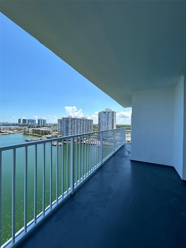 balcony featuring a water view