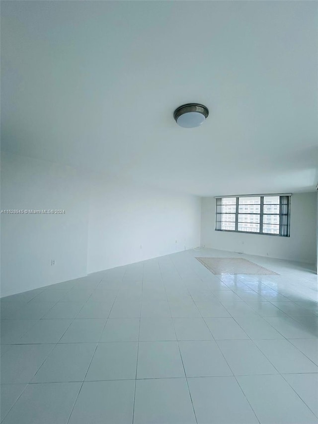 empty room with light tile patterned floors