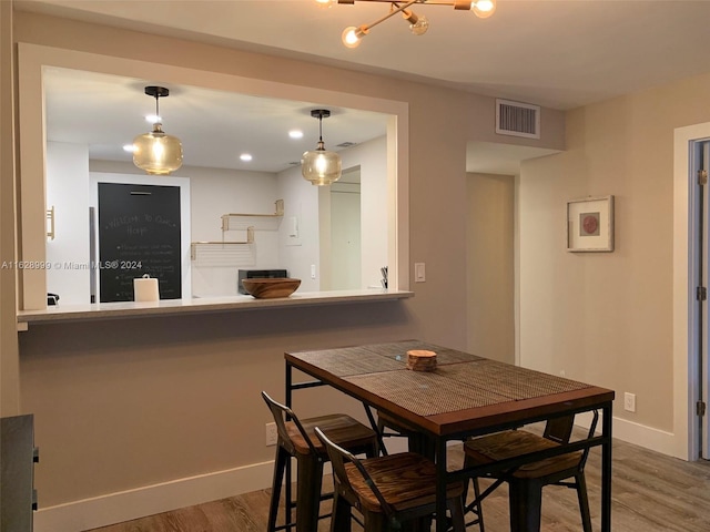 dining room with hardwood / wood-style floors