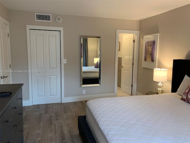 bedroom featuring a closet and hardwood / wood-style flooring