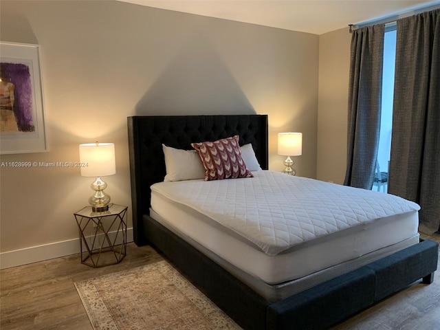 bedroom with light wood-type flooring