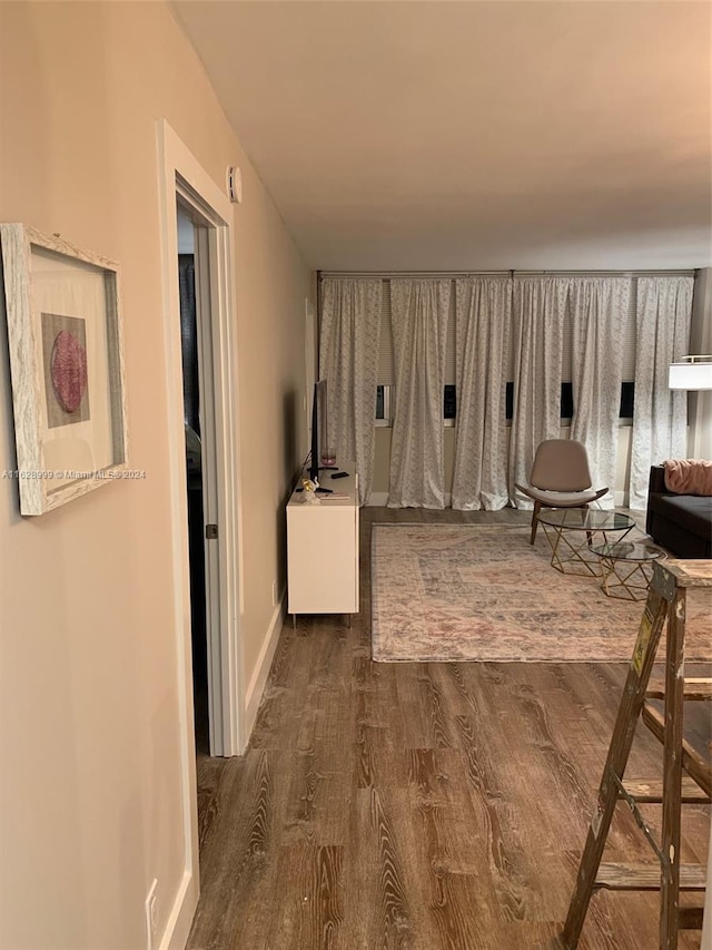 unfurnished room with hardwood / wood-style flooring