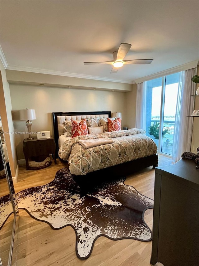 bedroom with ceiling fan, crown molding, access to outside, and light hardwood / wood-style flooring