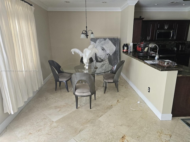 dining area featuring an inviting chandelier and crown molding