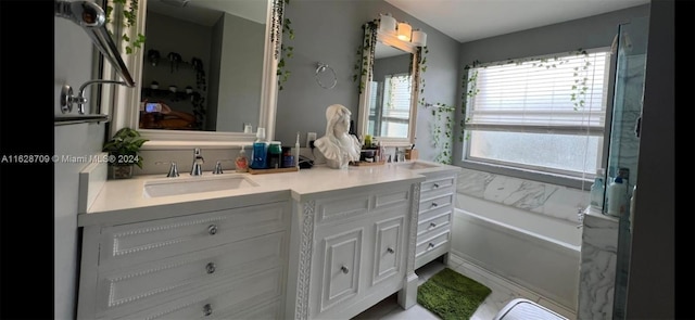 bathroom with a bathtub and vanity