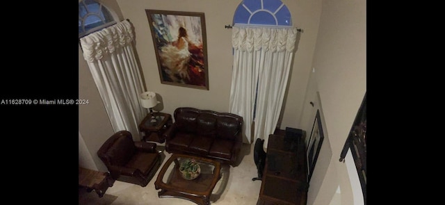 sitting room featuring light colored carpet