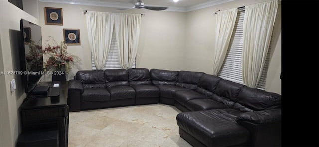 living room with ceiling fan and ornamental molding