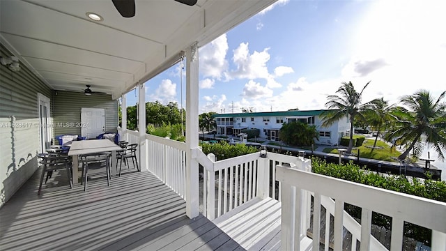 wooden deck featuring ceiling fan