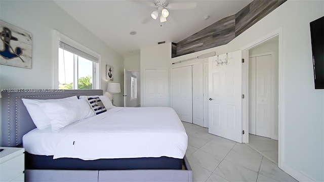 bedroom featuring ceiling fan and light tile patterned floors