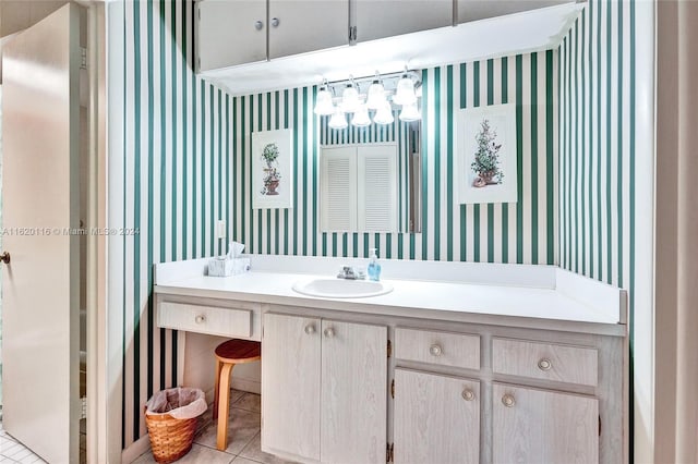 bathroom with tile patterned flooring and vanity