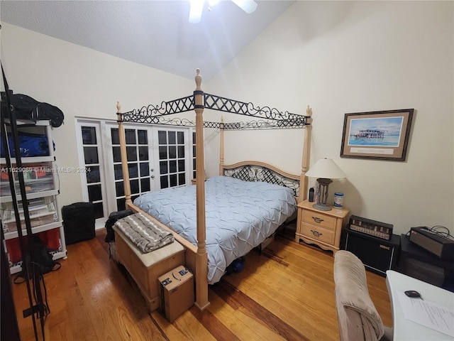 bedroom featuring ceiling fan, french doors, and wood-type flooring