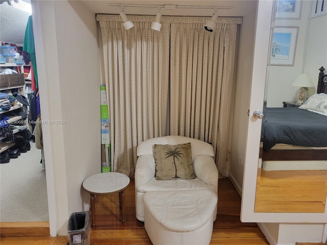 living area with hardwood / wood-style floors