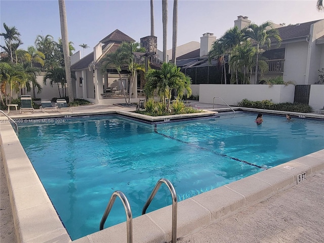 view of swimming pool with a patio area