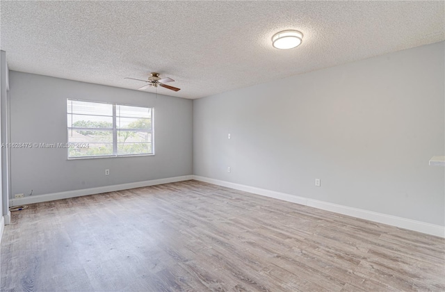 unfurnished room featuring a textured ceiling, ceiling fan, and light wood-type flooring