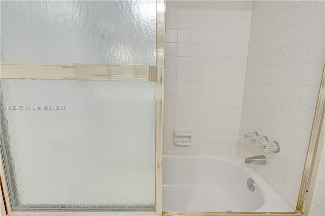 bathroom featuring shower with separate bathtub