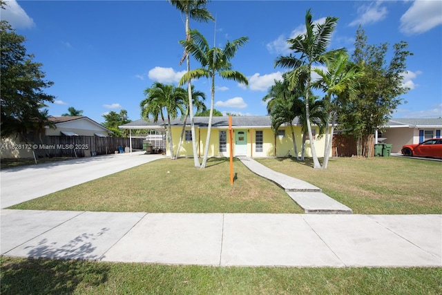 single story home with a front yard and a carport