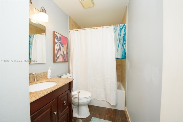 full bathroom with shower / bathtub combination with curtain, vanity, and toilet