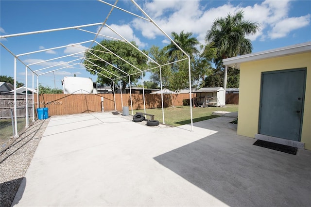 view of patio / terrace with a shed