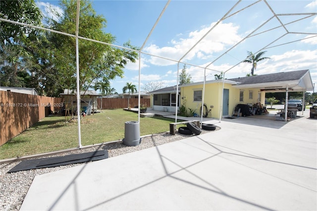 view of front of property with a patio, a sunroom, and a front yard