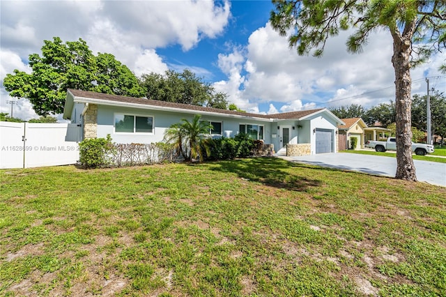 single story home with a garage and a front yard