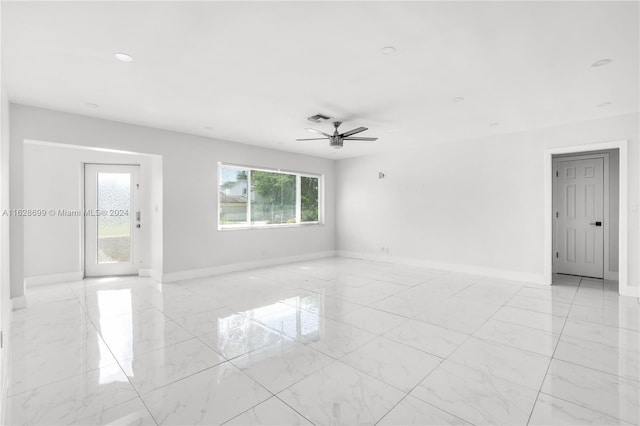 unfurnished room featuring ceiling fan