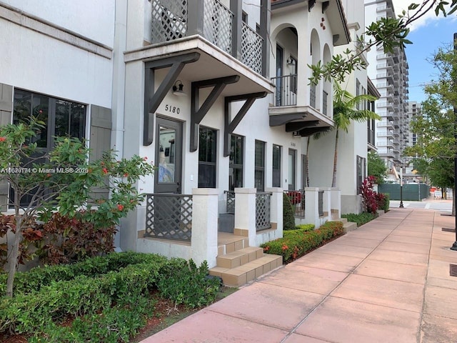 doorway to property featuring stucco siding