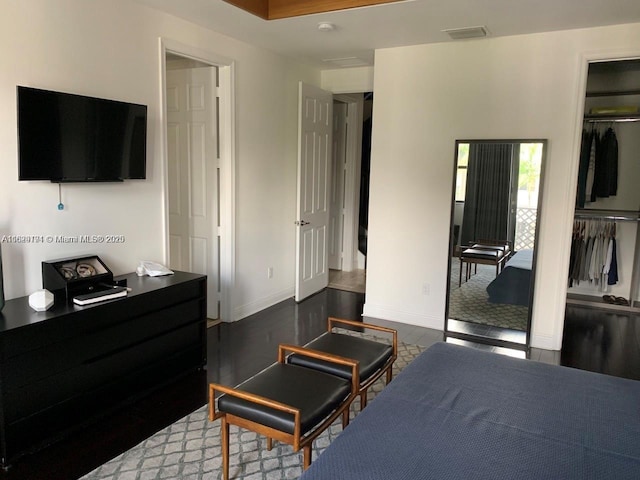 tiled bedroom with baseboards, visible vents, and a closet